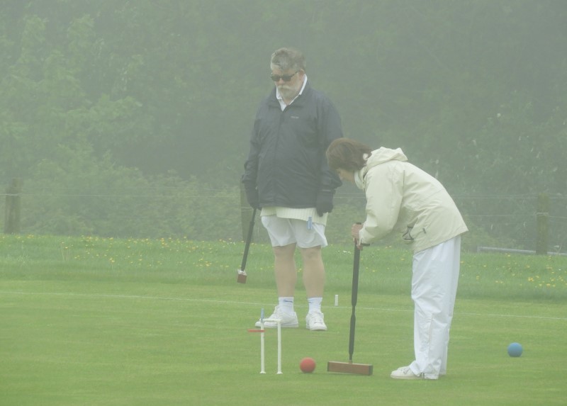 On a wet and misty day, Kathleen runs the Golden Hoop